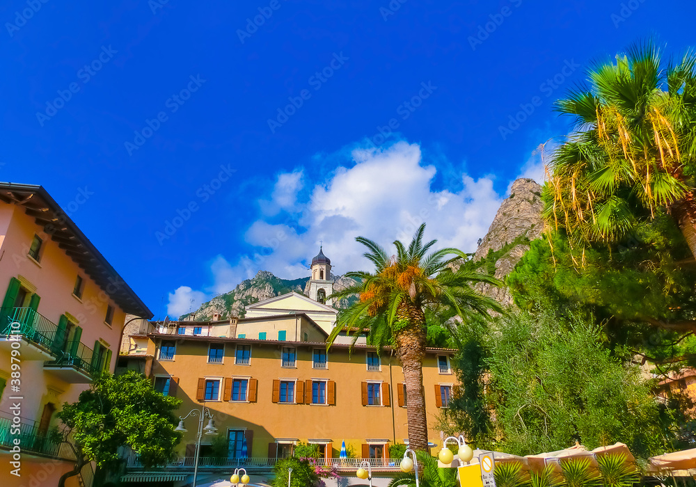 Limone sul Garda, Italy - September 21, 2014: The boardwalk with houses and boats