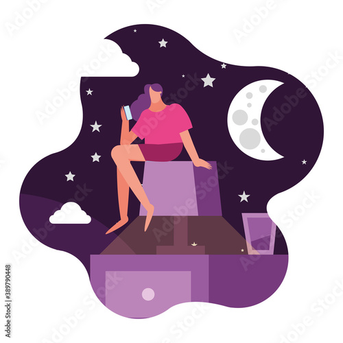 woman using smartphone seated in lamp and night scene suffering from insomnia