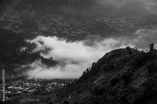 black and white view of tourist destinations in the Dieng Plateau, Central Java. see rural scenery at the foot of the Sikuning mountains and Mount Sindoro and the hills decorated with a thin fog © Aldi