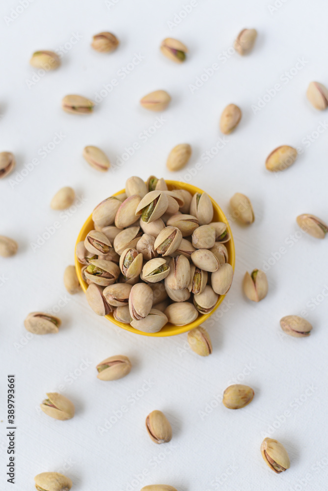 pistachios , many heap of pista dry fruits and nuts in background layout , Kerala India. nuts pattern background , layout of seeds, Protein fiber rich food diet muscle body building pistachios , many heap of pista dry fruits and nuts in background layout , Kerala India. nuts pattern background , layout of seeds, Protein fiber rich food diet muscle body building