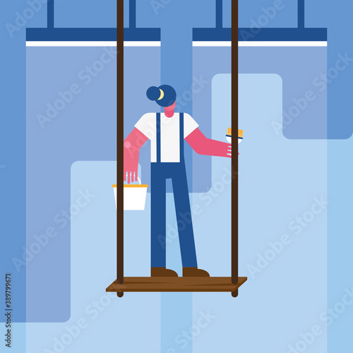 female constructor worker remodeling painting in scaffold