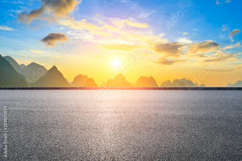 Country asphalt road and green mountain natural scenery in Guilin at sunrise China.