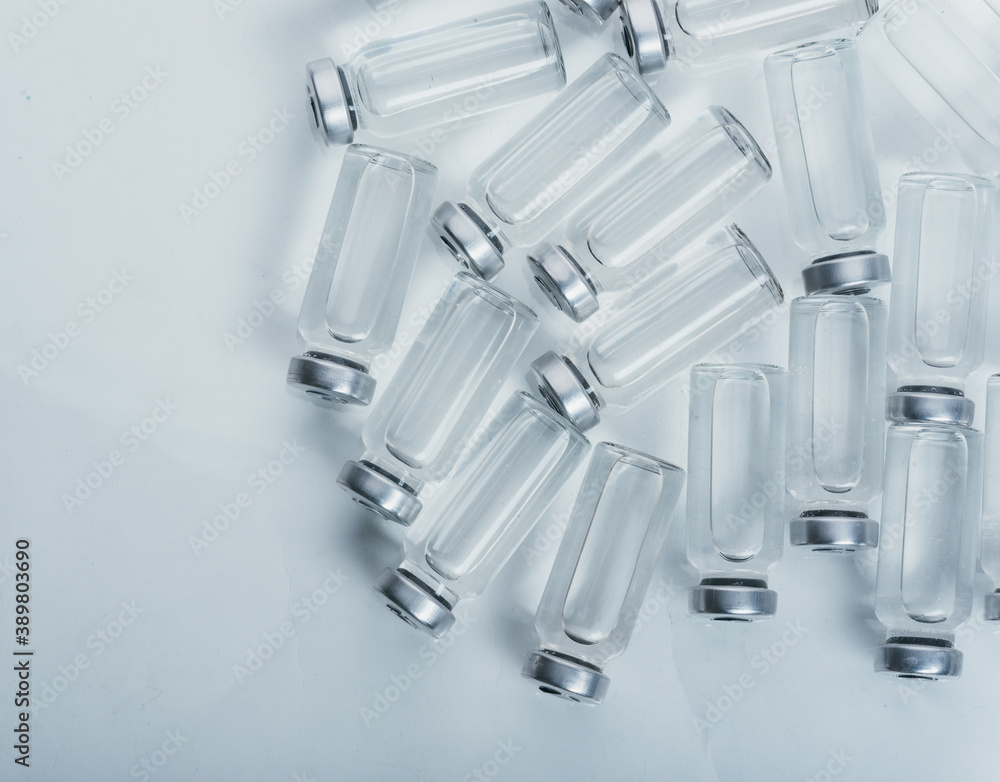 Glass medical ampoule vial for injection. Medicine is dry white drug ...