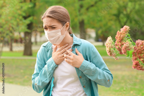 Young woman in medical mask...