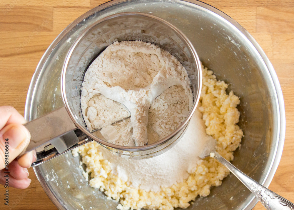 Sift flour dough bowl, top view into metal tool Sift flour dough bowl, top view into metal tool