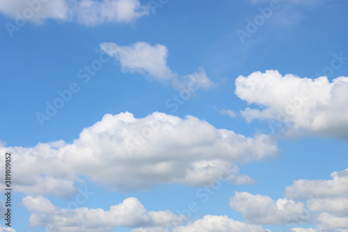 Bright blue sky with white clouds for background or wallpapers © Nattawut