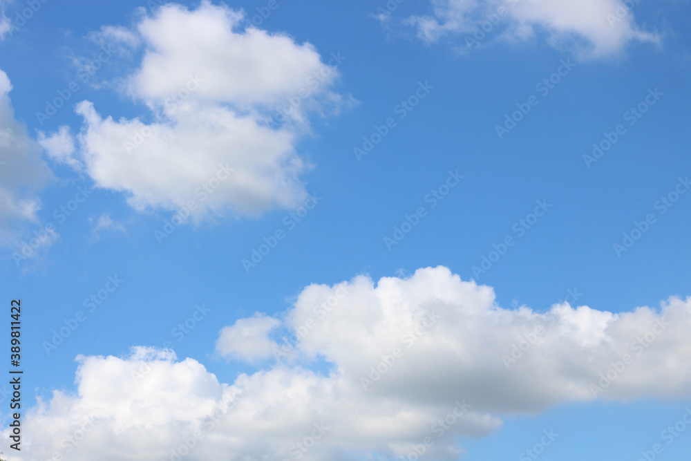 Obraz premium Bright blue sky with white clouds for background or wallpapers