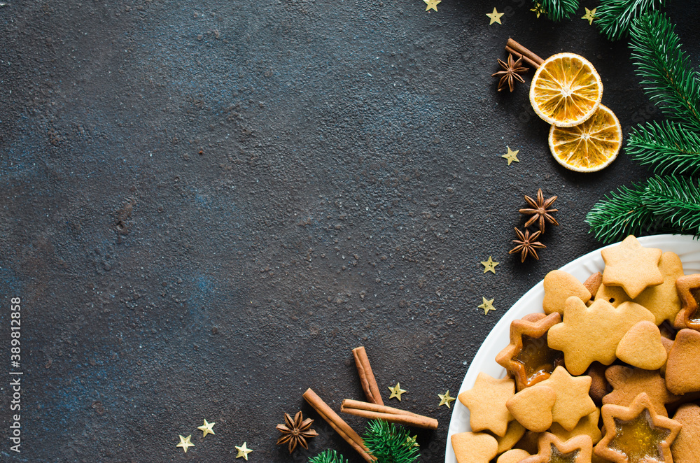 Culinary background with freshly baked Christmas gingerbread, spices and fir branches. Copy space. Culinary background with freshly baked Christmas gingerbread, spices and fir branches. Copy space.