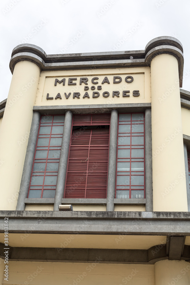 The facade and main entrance of Mercado dos Lavradores a fruit, vegetable, flower and fish market in Funchal, Madeira. The building was designed by Edmundo Tavares The facade and main entrance of Mercado dos Lavradores a fruit, vegetable, flower and fish market in Funchal, Madeira. The building was designed by Edmundo Tavares