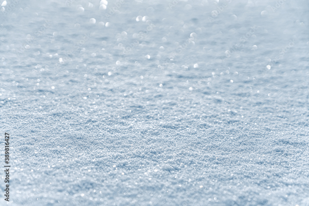 Obraz premium Winter snow. Snow texture with bokeh, light, selective focus. Snowy white texture. Snowflakes