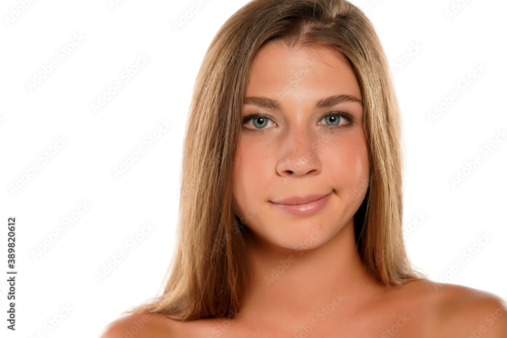 Portrait of a young beautiful woman with a half smile Portrait of a young beautiful woman with a half smile