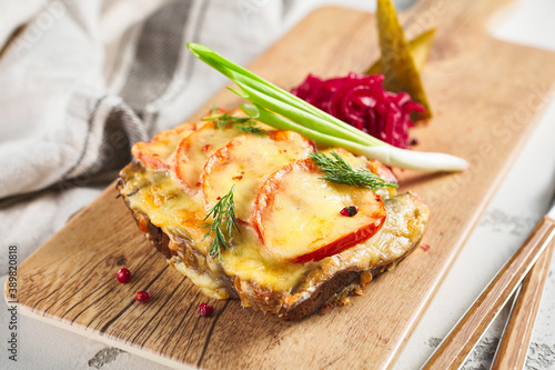 Bilde på lerret Open grilled cheese sandwich with fish and tomatoes