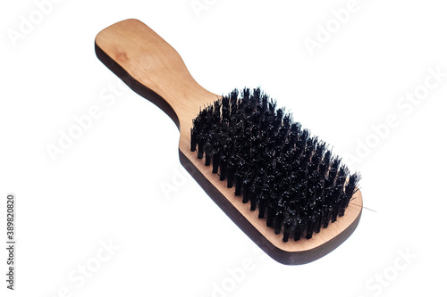 Wooden beard brush on white isolated background. Man care product