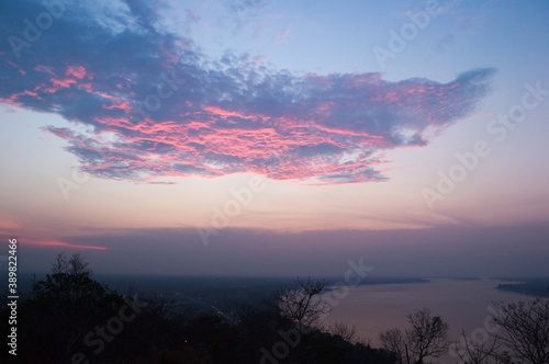 Beautiful pink clouds on a sunset above the Mekong River near Pakse, Laos
