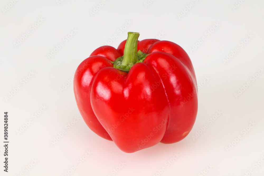 Ripe red bell pepper isolated on white