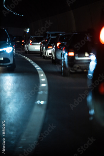 Heavy Traffic Inside A Highway Urban Tunnel. Cars going slow through a tunnel due to a congestion, traffic jam. © lightpoet