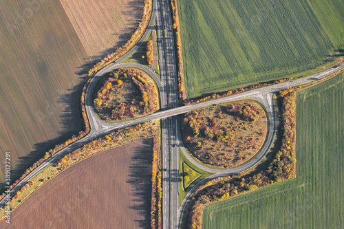 Autobahn in Germany as seen from above. Aerial view of freeway ramp and exit.