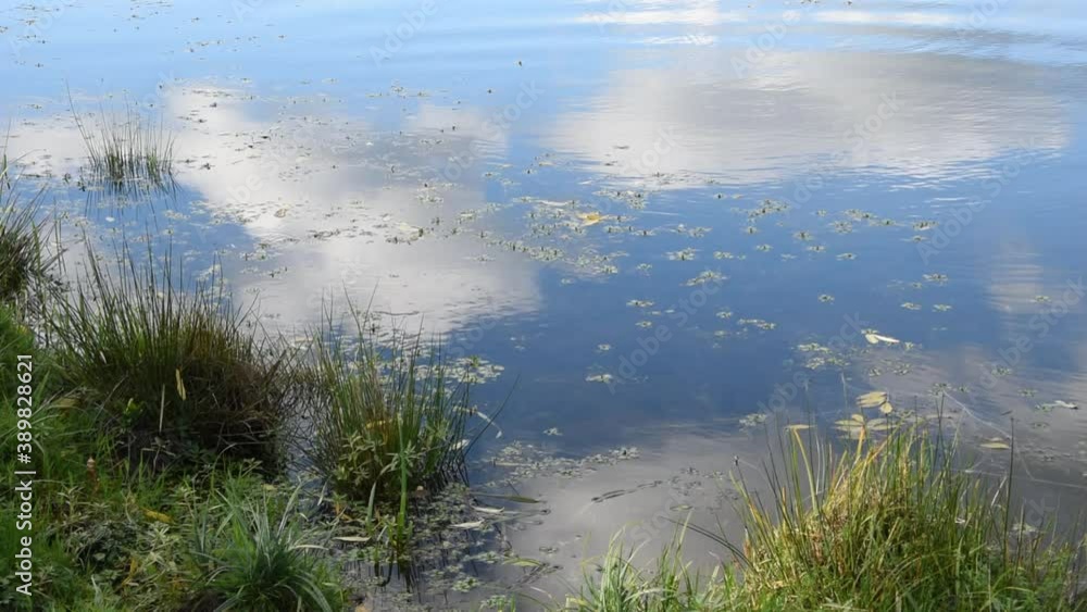Background with clouds reflecting on the water surface Background with clouds reflecting on the water surface