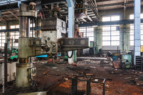 Photography An abandoned old large industrial hall is waiting for demolition, an Industrial machine for metal processing, A former Khabarovsk plant for the production of a diesel engine