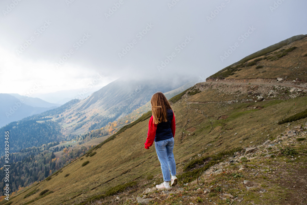 Young woman on a mountain hike in Sochi, Russia.