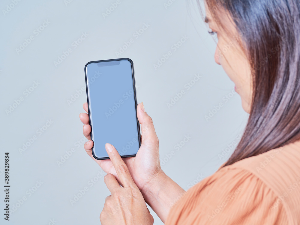 Close up of woman using smartphone