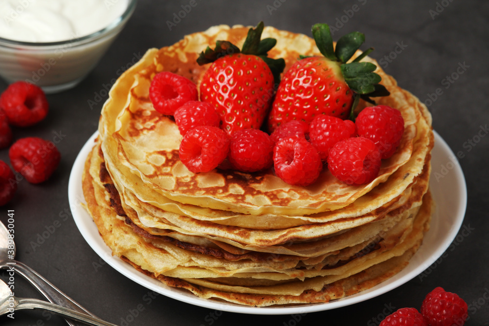 Russian cuisine national dish bliny with fresh berries Russian cuisine national dish bliny with fresh berries