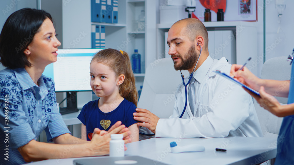 Obraz premium Caring medical doctor consulting girl in office with stethoscope checking breath. Specialist in medicine providing health care service consultation diagnostic examination treatment in hospital cabinet