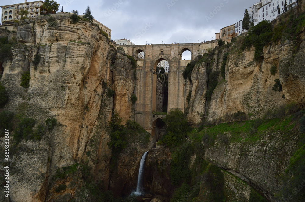 Cityscape of Ronda in Spain with Cliffs, Bridge, Andalusian Houses and Waterfall