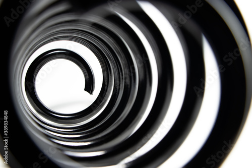 Inside the coiled metal springs on white