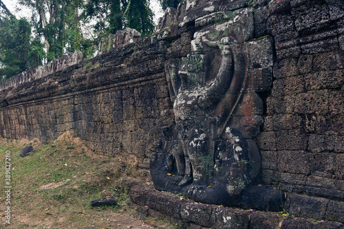 garudas holding nagas in the entrance of Preah Khan temple in Siem Reap Cambodia photo