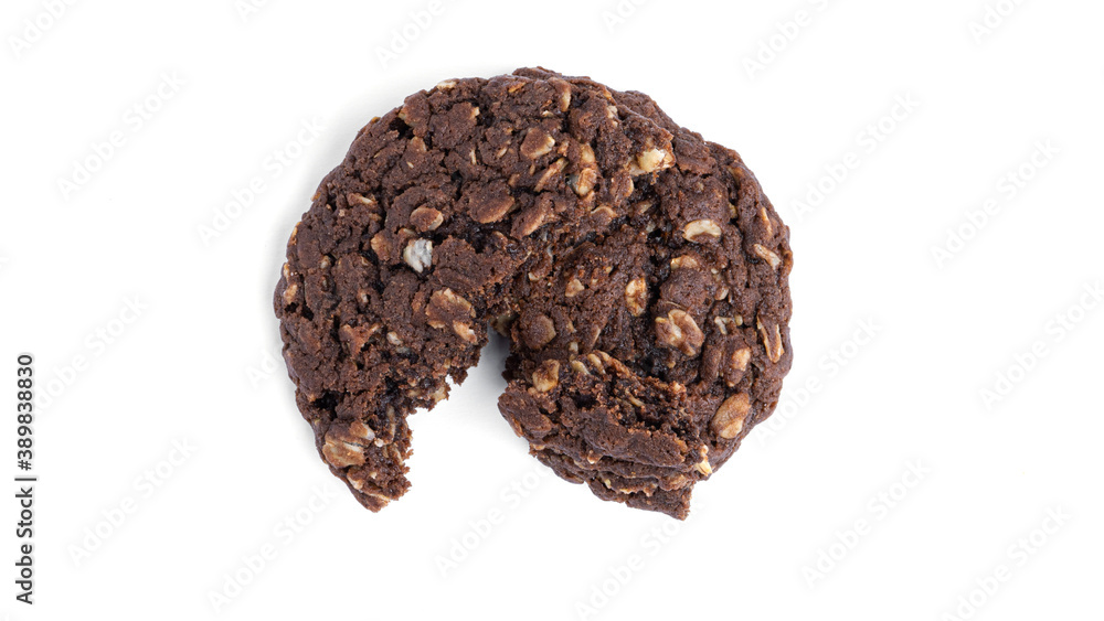 Chocolate oatmeal cookies with raisins and coconut on a white background. View from the top. High quality photo