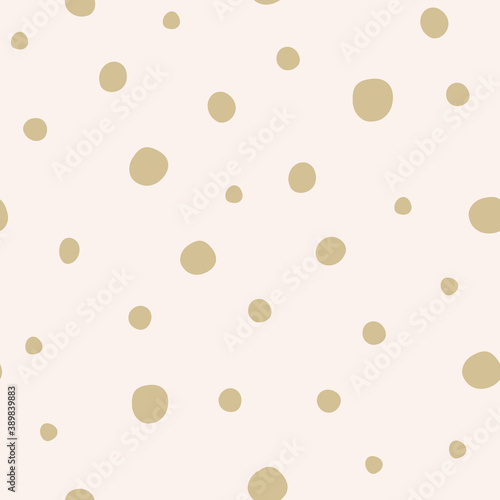 Cute hand drawn gold snow polka dots seamless pattern on pink background. Christmas snowflakes. Great for winter fabric, textile, nursery decoration, Christmas wrapping paper, scrapbooking. Surface