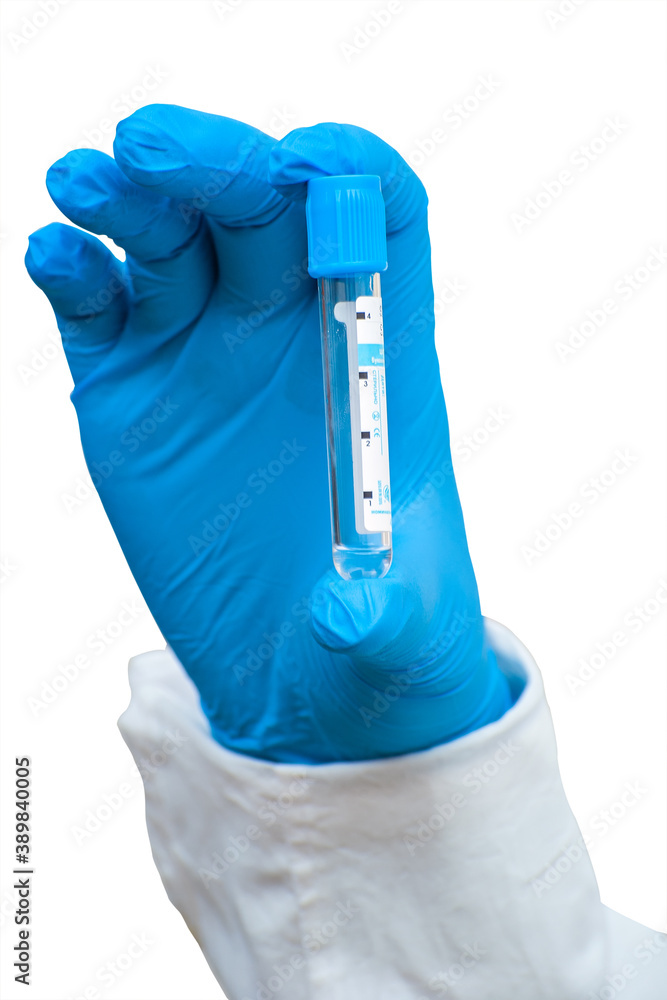 Hand in blue medical glove holds medicine capsule isolated on white background Hand in blue medical glove holds medicine capsule isolated on white background