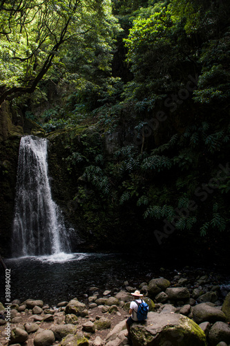 Men gazing a waterfall