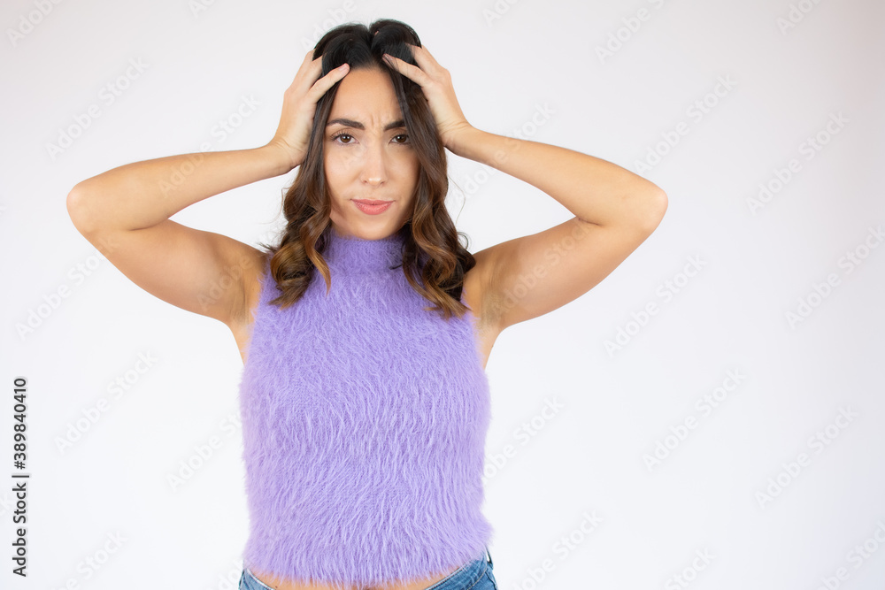 Beautiful young woman surprise holds head by hand. Shocked beautiful woman. Isolated on white background Beautiful young woman surprise holds head by hand. Shocked beautiful woman. Isolated on white background