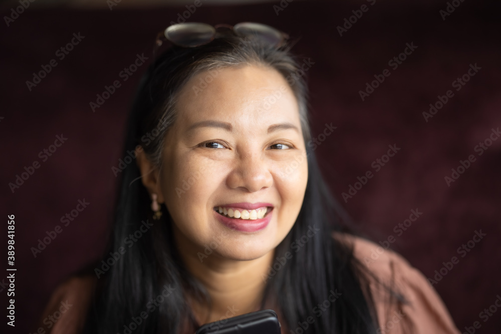 Portrait of smiling middle age Asian woman, Closeup cheerful female lifestyle Portrait of smiling middle age Asian woman, Closeup cheerful female lifestyle