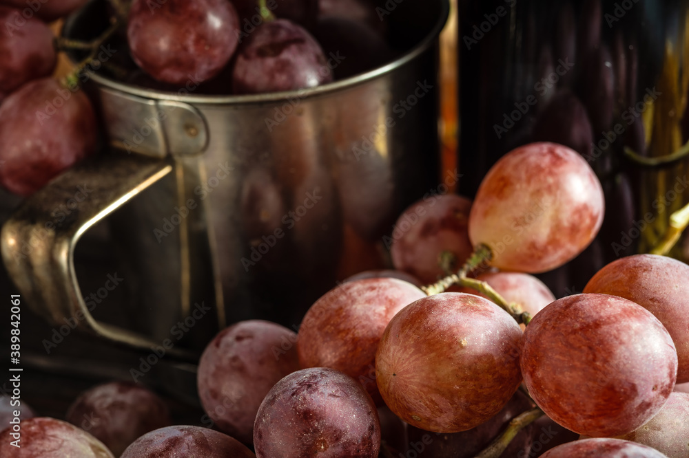 Autumn still life of red grapes on wooden background Autumn still life of red grapes on wooden background