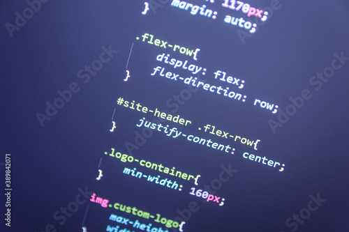 Website  theme code close up. Laptop screen with CSS code photo