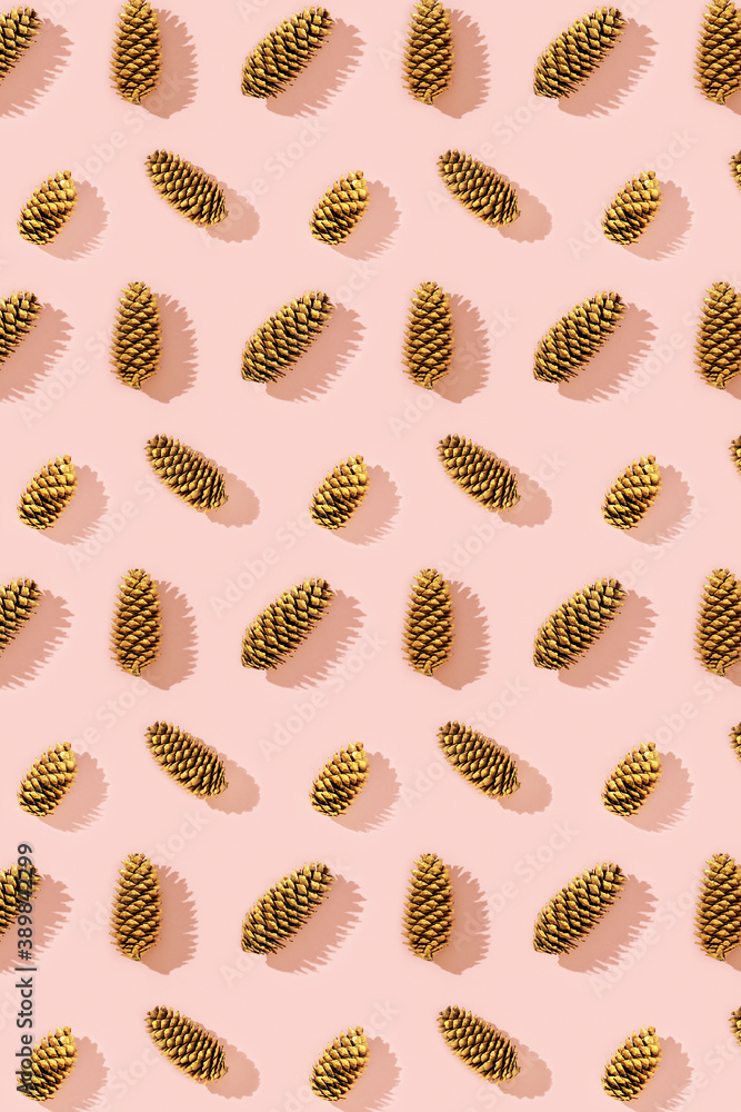 Natural pine cones golden colored as New Year pattern. Bright Christmas holidays decor Natural pine cones golden colored as New Year pattern. Bright Christmas holidays decor