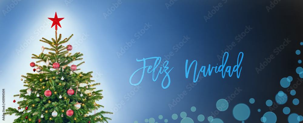 Spanish Text Feliz Navidad Means Merry Christmas. Christmas Tree With Christmas Ball Decoration And Ornamen Like Star. Blue Background WIth Bokeh Effect.
