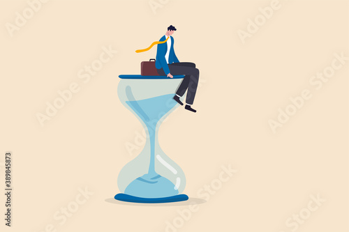 Wasting time waiting and never start new business, time fly or ineffective thinking or laziness concept, depressed businessman sitting on time passing sandglass or hourglass.