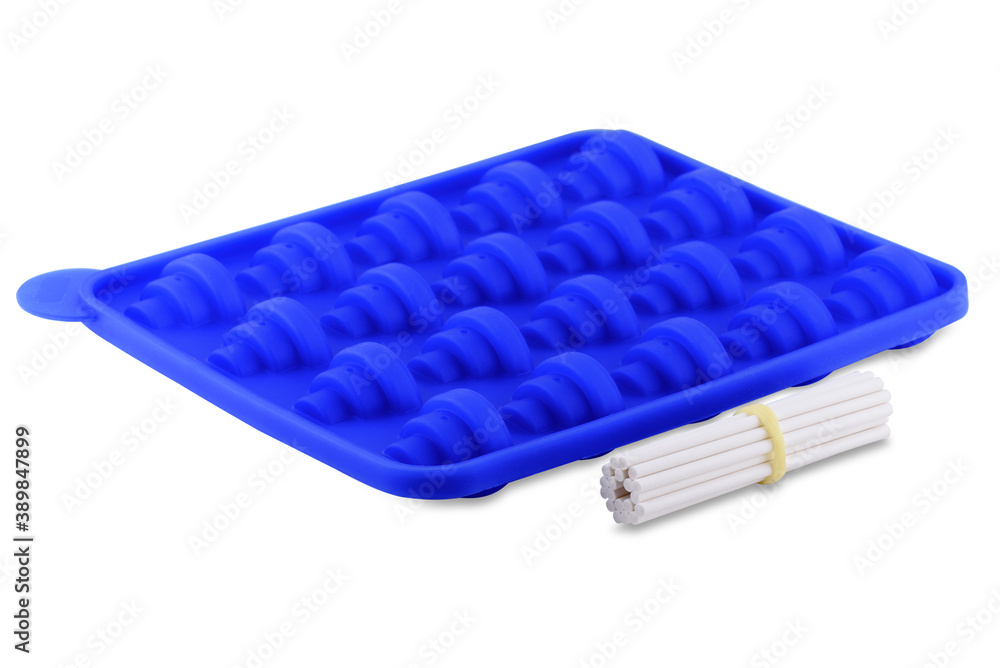 Blue silicone form isolated on white background. Lollipop, silicone mold, bakeware. Blue silicone form isolated on white background. Lollipop, silicone mold, bakeware.