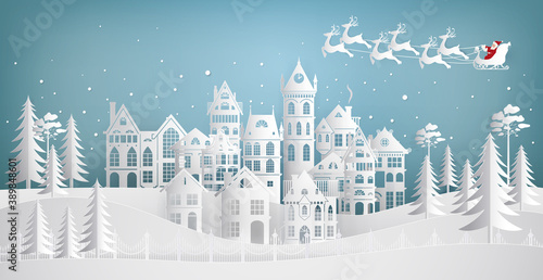 Santa Claus coming to city on a sleigh with deers. Merry Christmas and Happy New Year.  Paper art vector illustration.