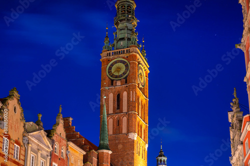 Beautiful clock of the town hall in Gdansk at night, Poland photo