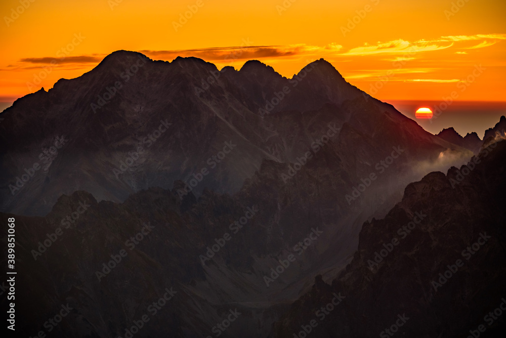 A beautiful sunrise over the High Tatras mountain ridge at Rysy on slovakian polish borders. 