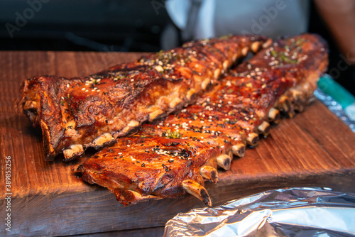 Giant grilled pork ribs prepare for party