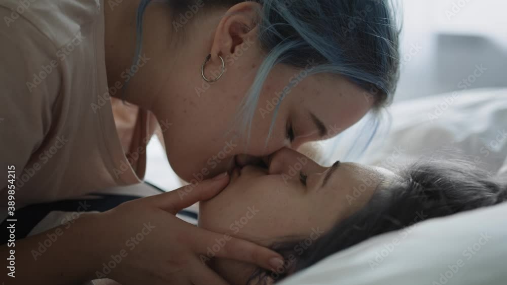 Close up video of lesbian couple kissing in the bed. Shot with RED helium camera in 8K. Close up video of lesbian couple kissing in the bed. Shot with RED helium camera in 8K.