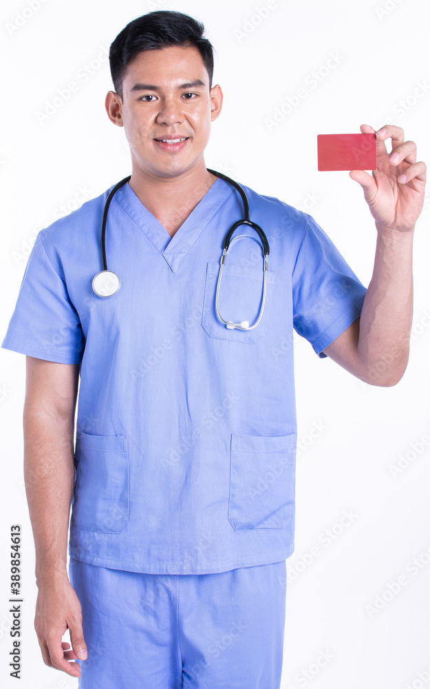 Portrait of young doctor smiling, holding credit card and standing on white background Portrait of young doctor smiling, holding credit card and standing on white background