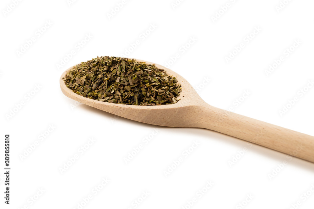 Oregano spice in wooden spoon isolated. Oregano spice in wooden spoon isolated.