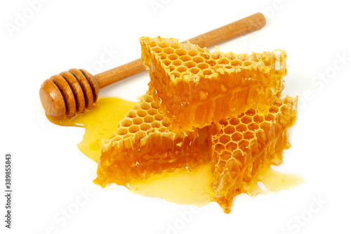 Liquid honey in combs on a white background.